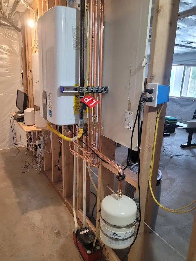 Licensed plumber repairing a kitchen sink in Stoneham